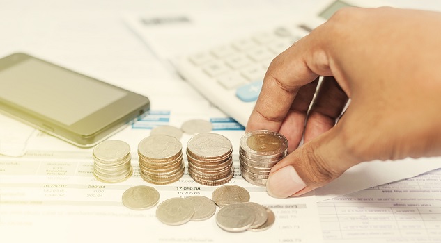Close up of hand stacking silver coins with phone on paper bill Business finance and money concept Save money for prepare in the future Vintage style